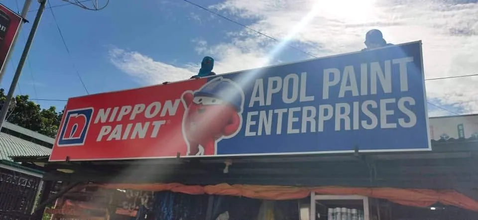 MCAV crew installing an Apol Paint Enterprises Panaflex sign