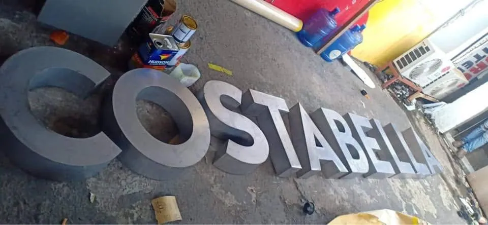 MCAV crew installing a Costabella aluminum built-up letters