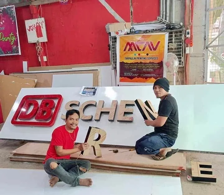 MCAV crew installing a DB Schenker acrylic built-up letters