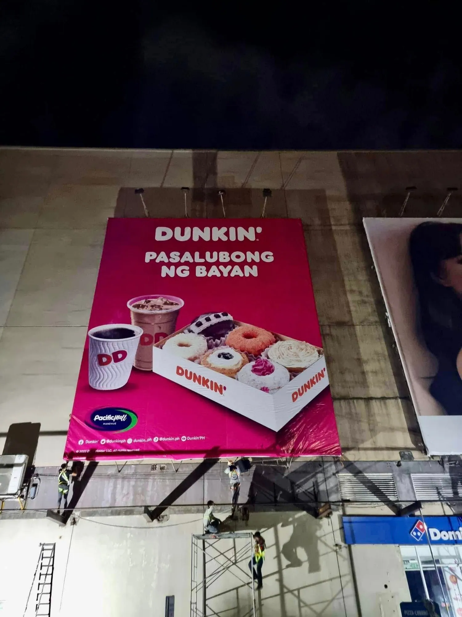 MCAV crew installing a Dunkin' billboard at Pacific Mall, Mandaue