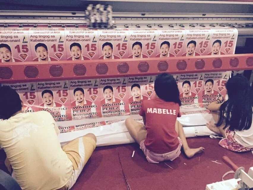 MCAV crew installing an Election campaign tarpaulin