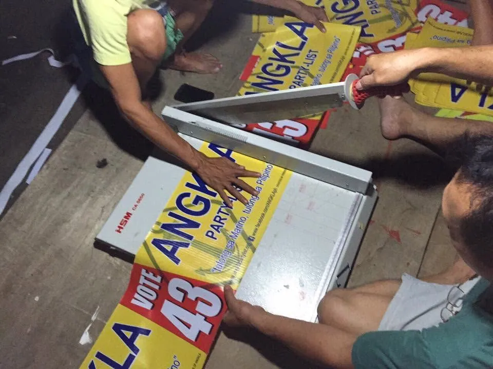 MCAV crew installing an Election campaign tarpaulin