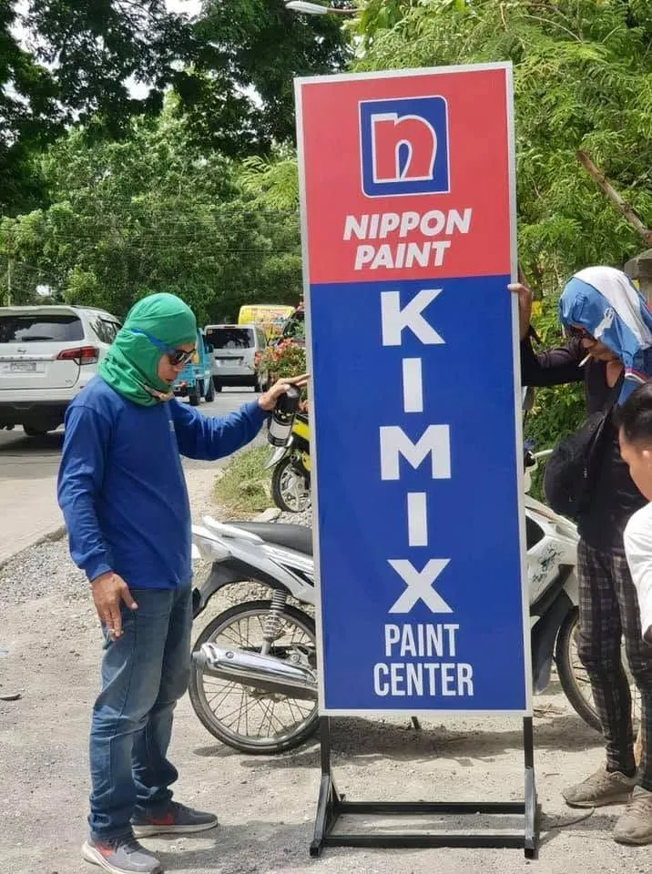 MCAV crew installing a Kimix Paint Center Panaflex sign