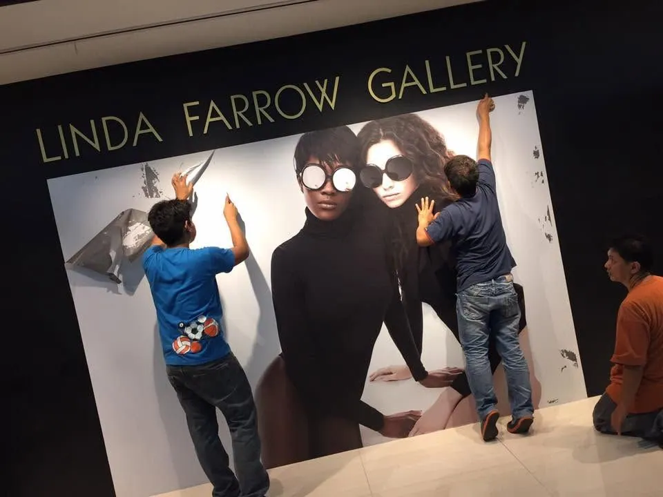 MCAV crew installing a Linda Farrow vinyl graphics