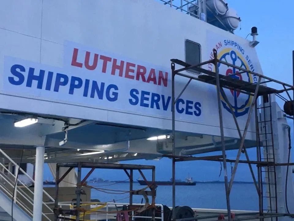 MCAV crew installing a Lutheran Shipping Services vinyl graphics
