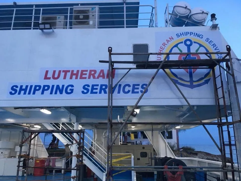 MCAV crew installing a Lutheran Shipping Services vinyl graphics