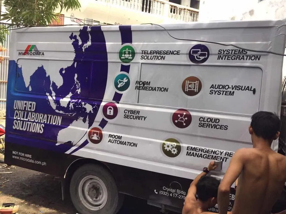 MCAV crew installing a Microdata Systems and Management, Inc. vehicle wrap