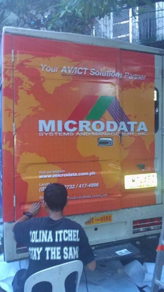 MCAV crew installing a Microdata Systems and Management, Inc. vehicle wrap