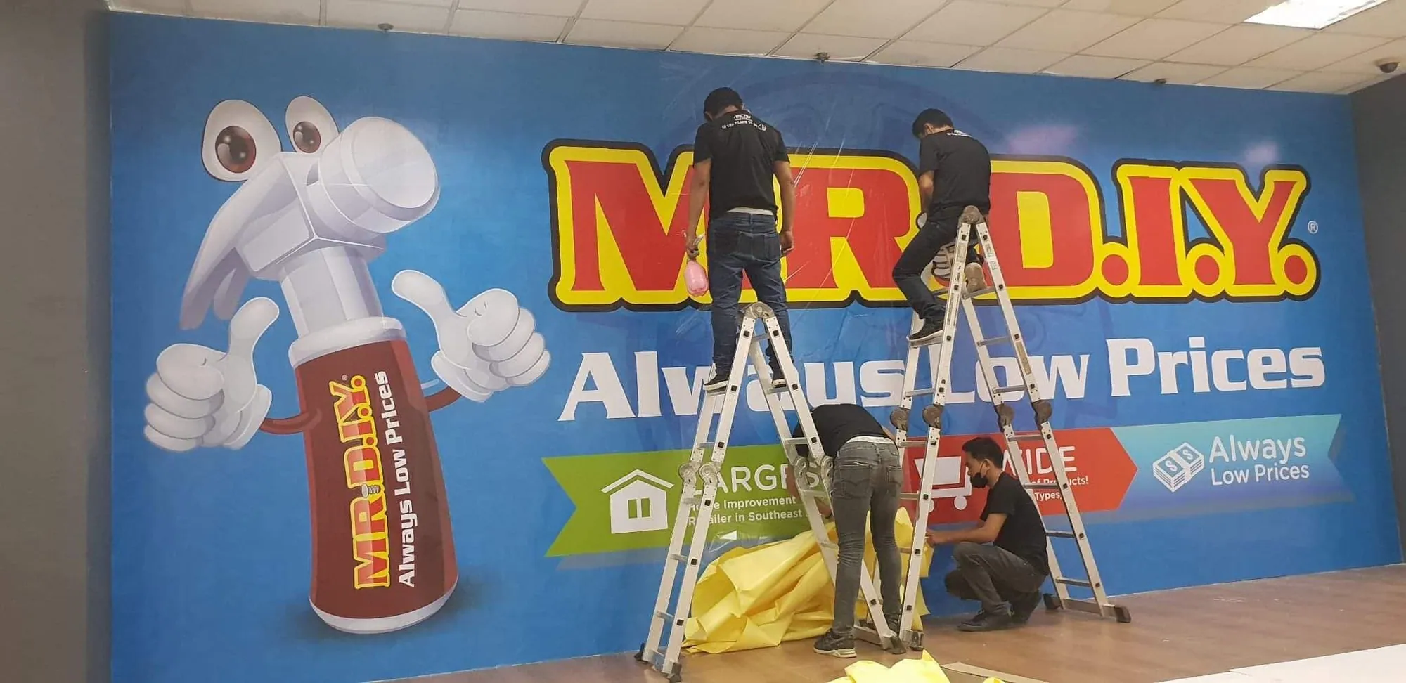 MCAV crew installing a Mr. D.I.Y. vinyl graphics