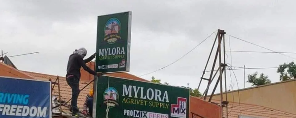 MCAV crew installing a Mylora Agrivet Supply Panaflex sign