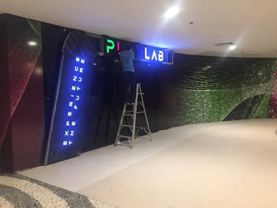MCAV crew installing a PlayLab lighted sign