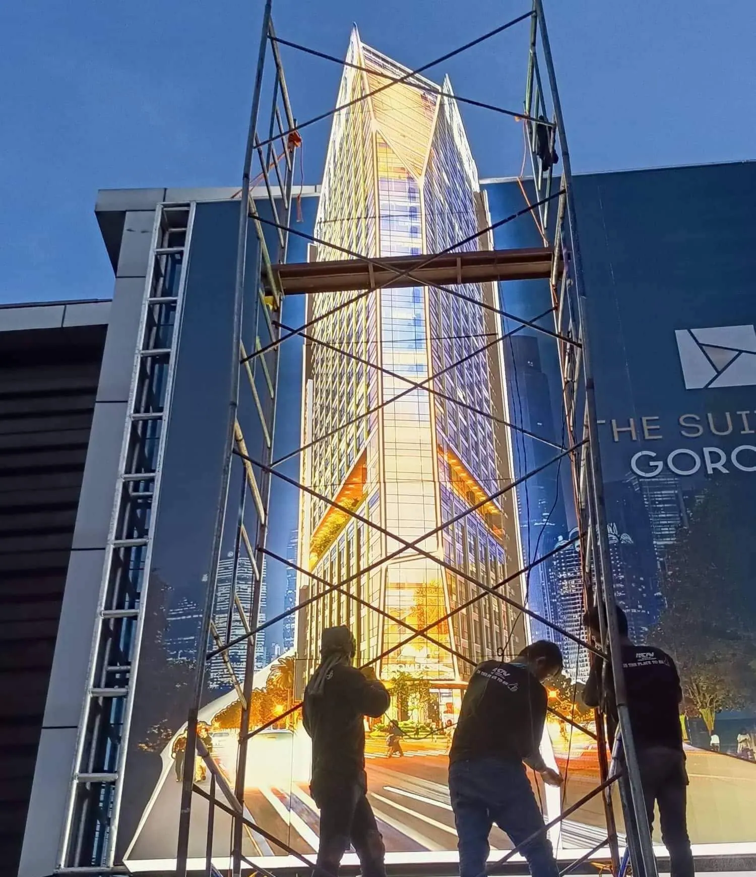 MCAV crew installing a The Suites at Gorordo billboard